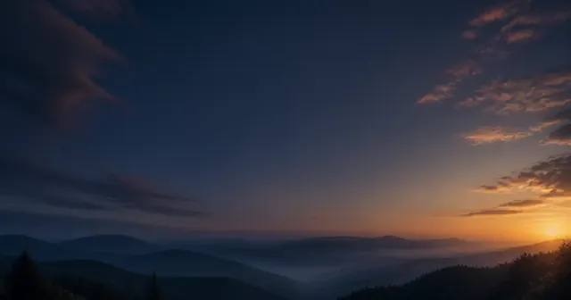 Colinas azul oscuro al amanecer, bajo un cielo que se vuelve anaranjado cerca del horizonte.